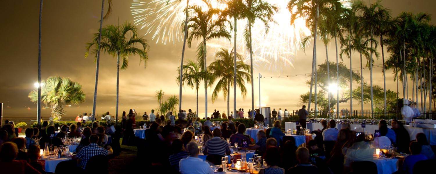 Fireworks display over evening outdoor beachside event